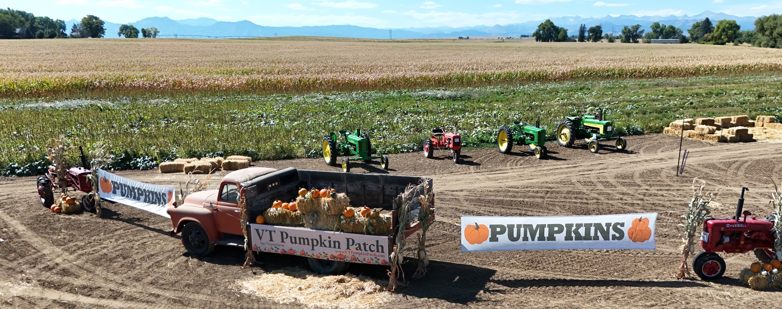 Vintage farm truck and pumpkin patch with the Front Range beyond